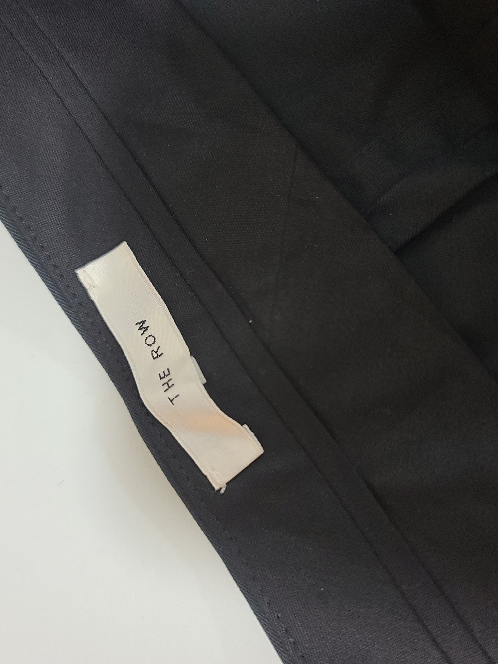 The Row black minimalist tailored piece